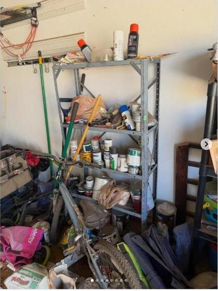 Before: cluttered garage before cleanout